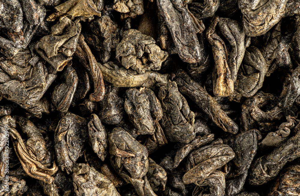 Green gunpowder tea, dry leaves under microscope, image width 23mm Green gunpowder tea, dry leaves under microscope, image width 23mm