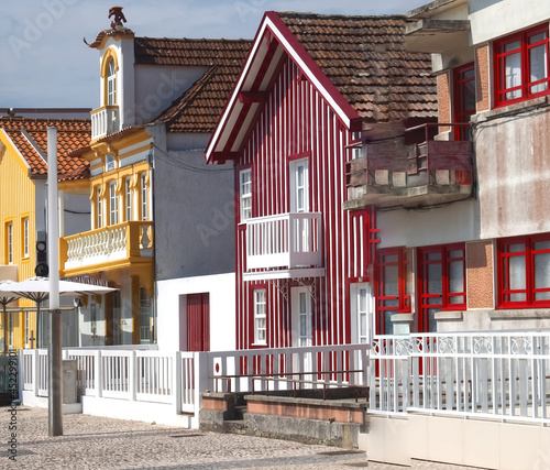 Colorful striped wooden beach houses at the promenade of Costa Nova, Aveiro, Portugal