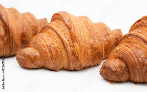 Fresh french croissants on white background.Side view of croissants Flat lay composition