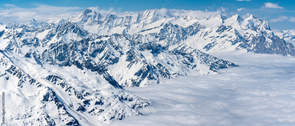 Fototapeta premium Switzerland, Panoramic view on Snow Alps and Blue Sky around Titlis mountain