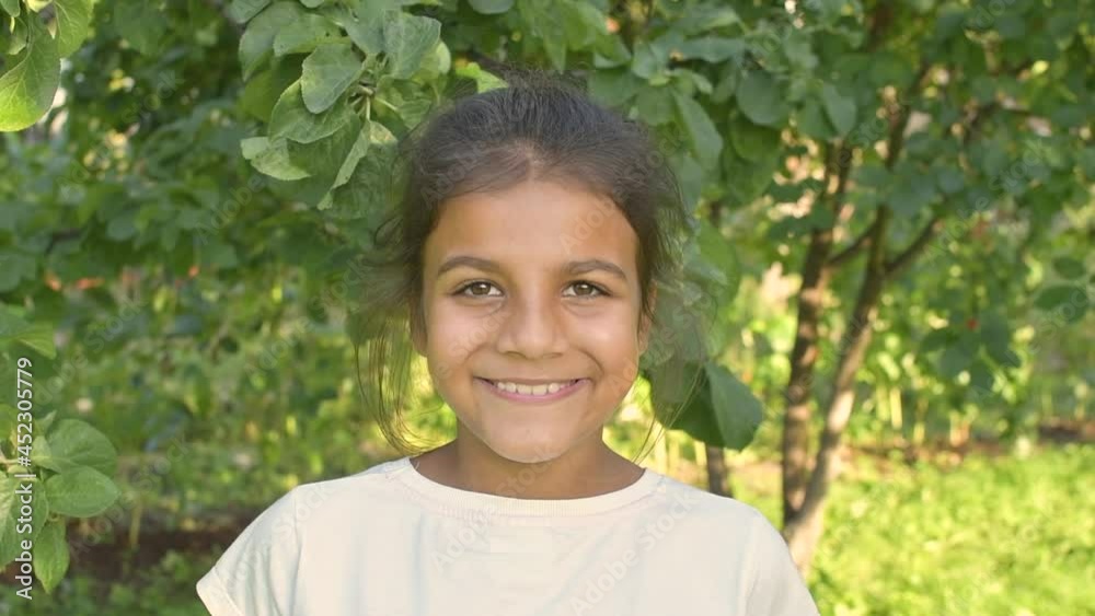 Portrait pakistani or indian Girl Looking at Camera. Young Laughs Happily Child Looking at Camera. Closeup. Inquisitive Kid Girl Portrait. Face Funny Contemplative Kid Child. Portrait pakistani or indian Girl Looking at Camera. Young Laughs Happily Child Looking at Camera. Closeup. Inquisitive Kid Girl Portrait. Face Funny Contemplative Kid Child.
