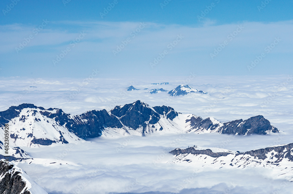 Switzerland, Panoramic view on Snow Alps and Blue Sky around Titlis mountain Switzerland, Panoramic view on Snow Alps and Blue Sky around Titlis mountain