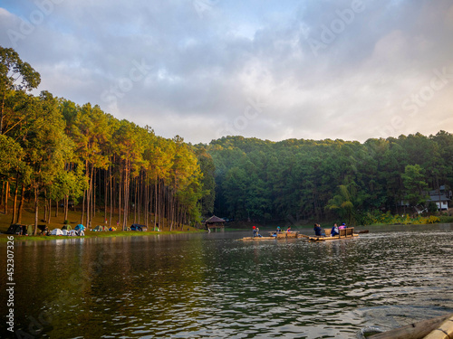 The beautiful sunshine with the pine and the raft on the reservoir of the higher mountain, Pang Oung, which dubbed is as Switzerland, Mae hong son, Thailand.