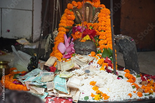 shiva linga with money image photo