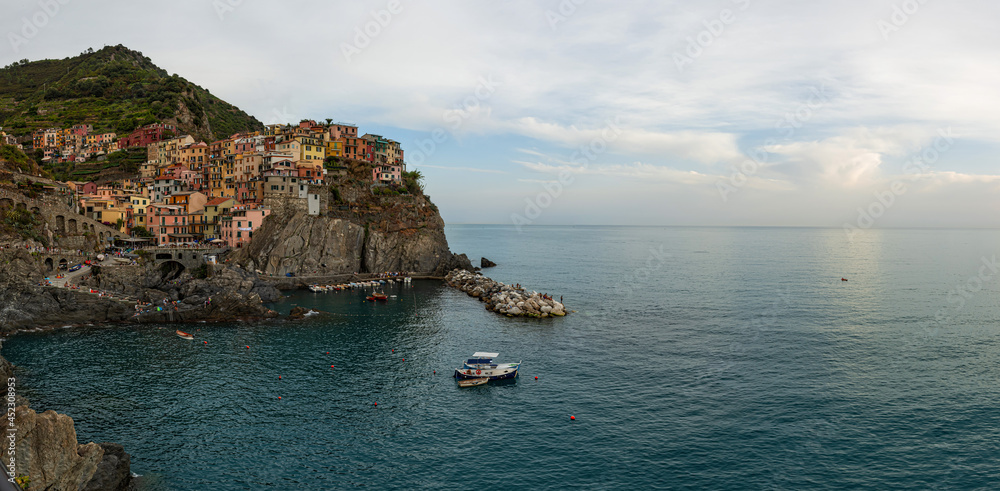 picturesque village of Manarola with colourful houses at the edge of the cliff Riomaggiore