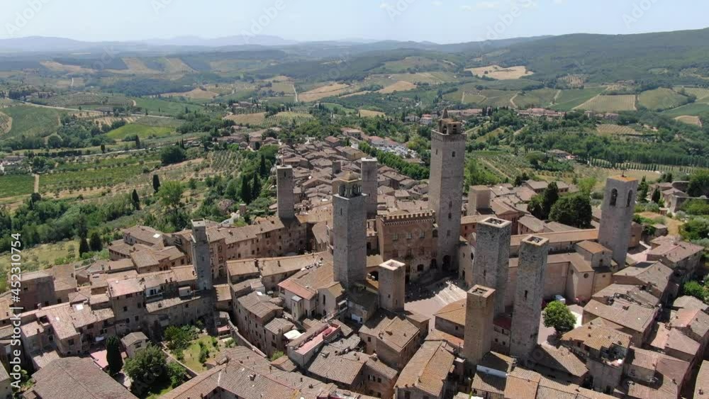 Flying over San Gimignano hill town in Tuscany, Italy, Europe Flying over San Gimignano hill town in Tuscany, Italy, Europe