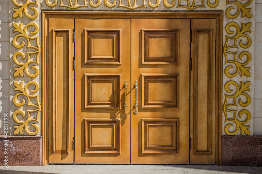 Large wooden doors of a public building. Close-up.