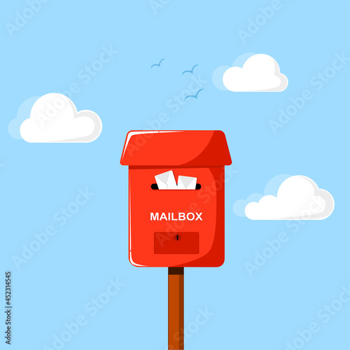 Red mailbox full envelopes on sky background