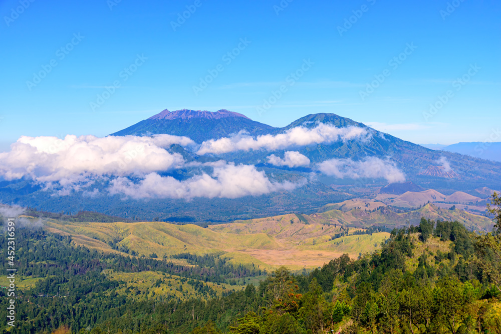 Landscape view of Mount Raung seen from of Mount Ijen, Banyuwangi, East Java, Indonesia.