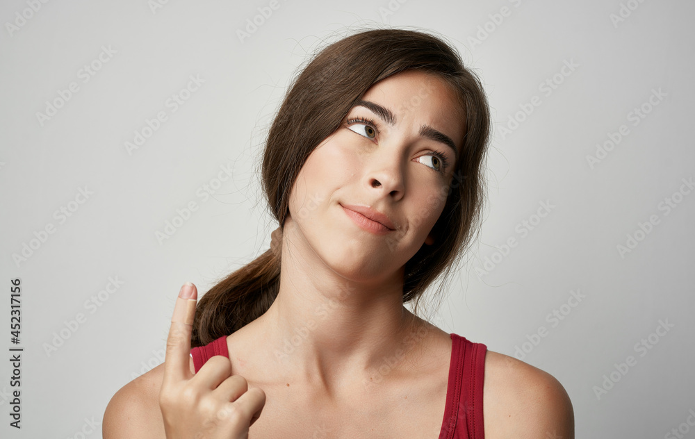 woman in red t-shirt injured finger health problems woman in red t-shirt injured finger health problems
