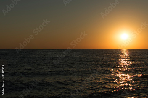 Landscape. A sunny sunset on the seashore.