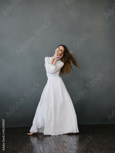 pretty woman in white dress posing full length Studio Model