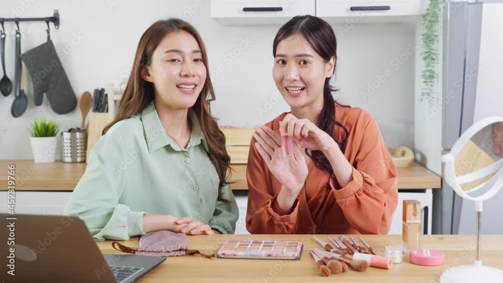 Asian lesbian vlogger talk with camera to review the cosmetic at home. Asian lesbian vlogger talk with camera to review the cosmetic at home.