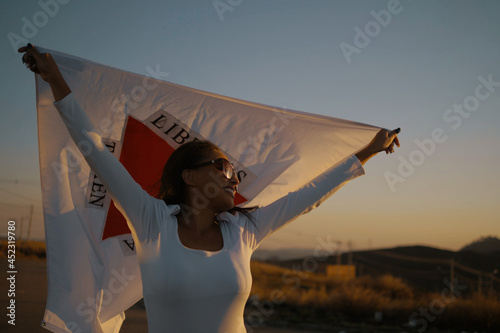 Black girl with Minas Gerais state flag photo
