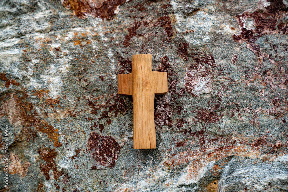 Against the backdrop of a rock section, Wooden Cross.