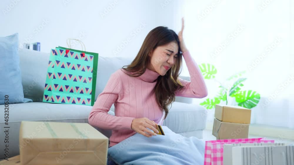 Asian attractive female worry about financial problem after shopping. Asian attractive female worry about financial problem after shopping.