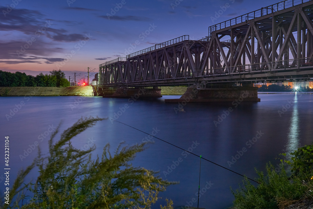 Fototapeta premium Dawn over the railway bridge in Voronezh
