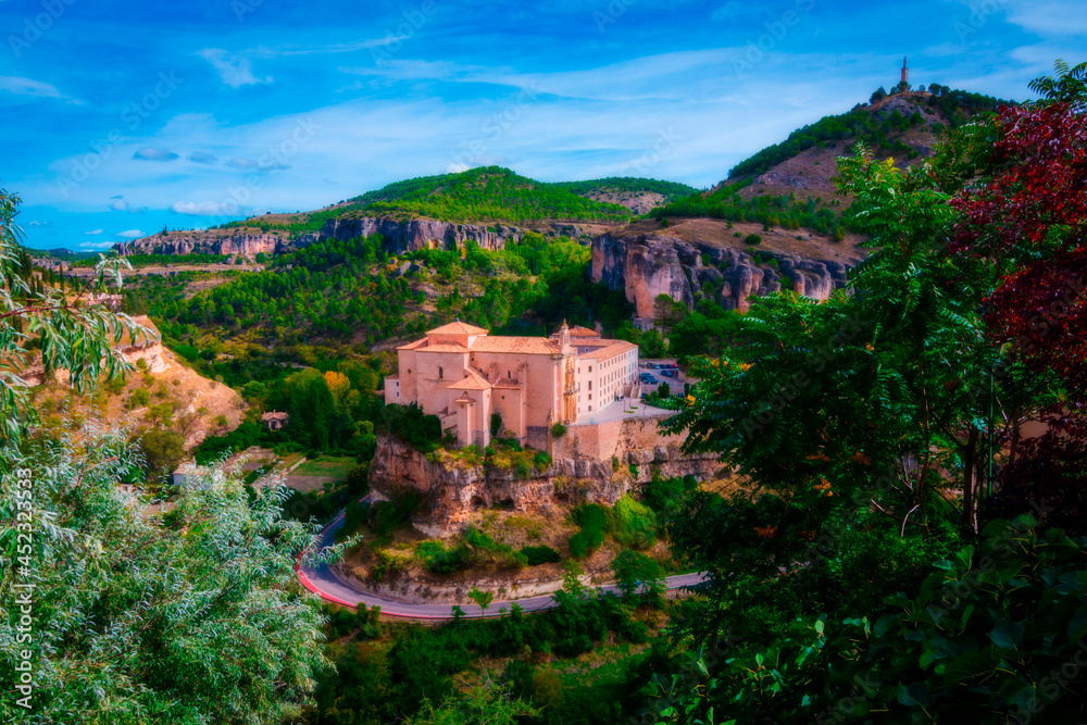 Cityscape in old town in daylight. Parador Nacional, former Convent of San Pablo in the old town in Cuenca, World Heritage Site, Spain. Horizontal view