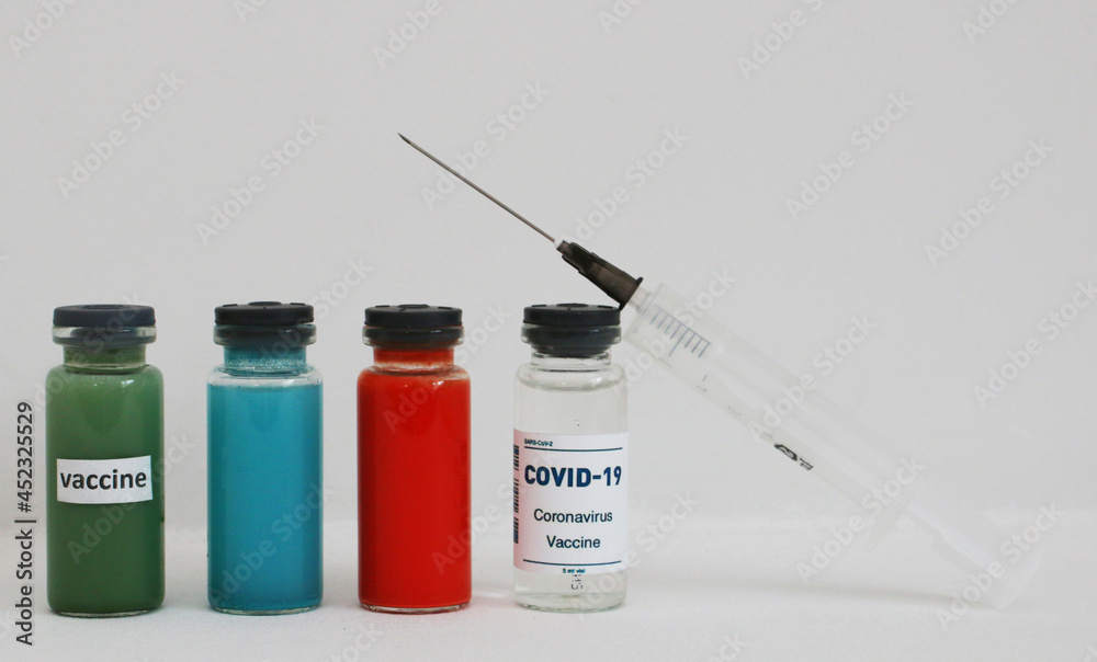 White, red, green and blue ampoule with vaccine. White, red, green and blue ampoule with vaccine.