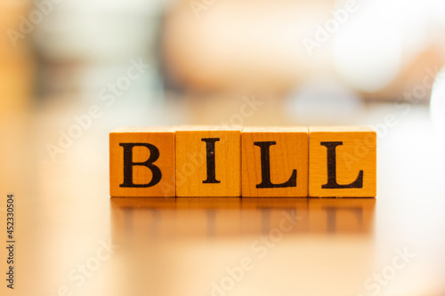 The word Bill and blur background,The word on wood square cubes,Concept word cubes, Wooden box