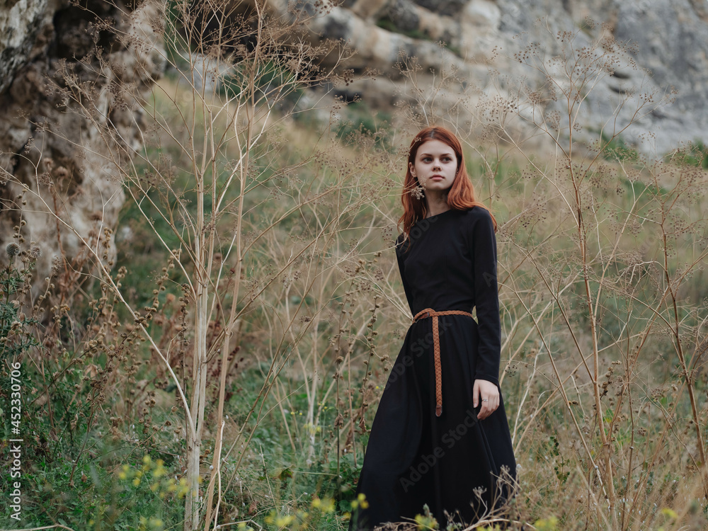 pretty redhead woman in black dress walk landscape freedom pretty redhead woman in black dress walk landscape freedom