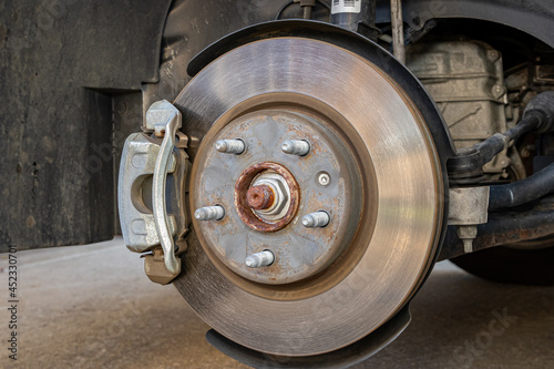 Vehicle brakes parts. Caliper and rotor on car. Brake inspection, repair, service and maintenance concept