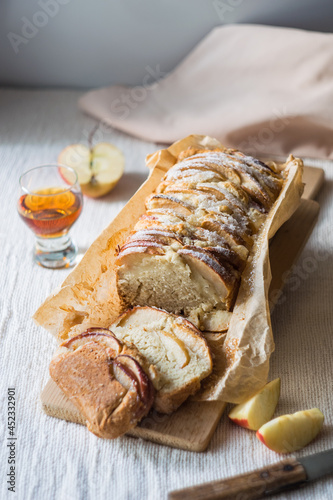 Apple cinnamon dessert bread cake on wooden board, selective focus