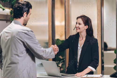 Hotel check in at reception or front office being given key card