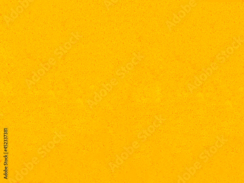 The yellow concrete wall texture with vintage style, Blank of shiny yellow paint cement background with copy space concept