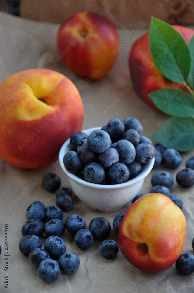 Colorful summer fresh fruits - nectarines, peaches and blueberries Colorful summer fresh fruits - nectarines, peaches and blueberries
