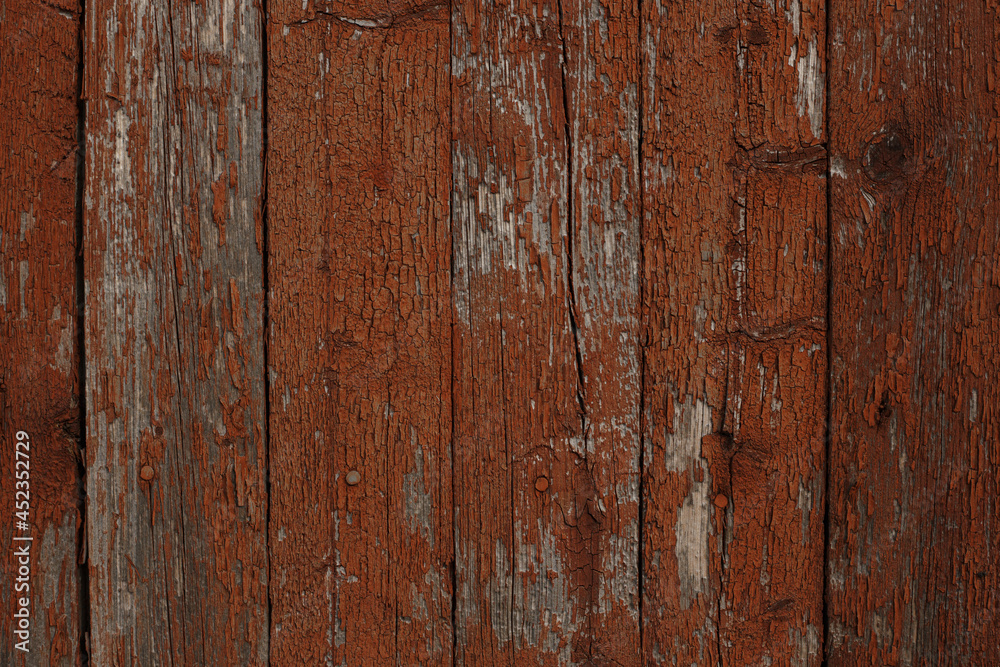 Background of textured wooden wall with brown peeling paint Background of textured wooden wall with brown peeling paint
