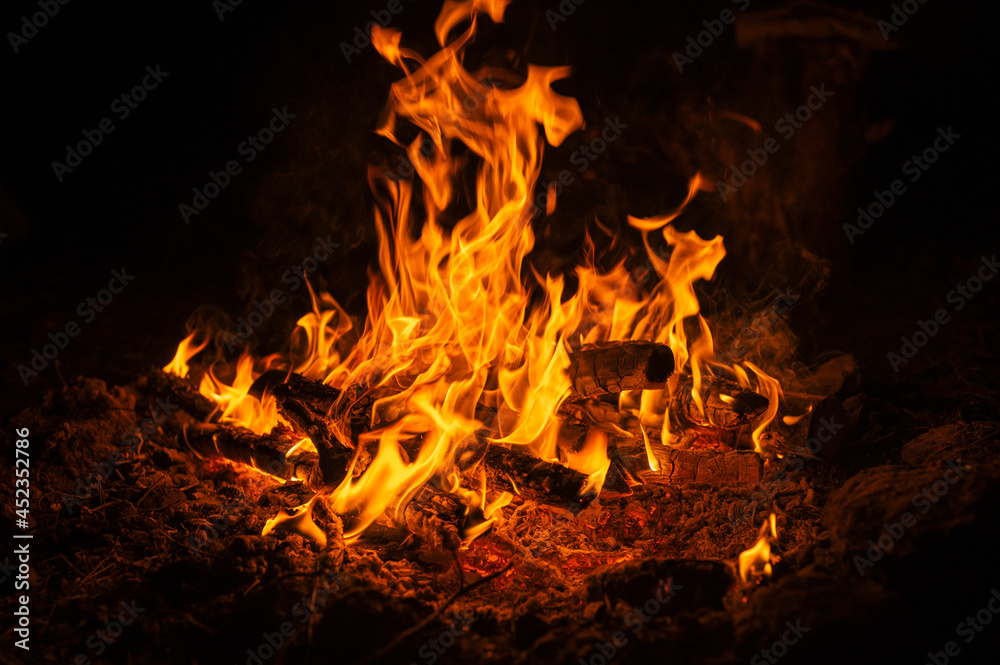 blurred campfire in the night. bonfire with a burning flame in the dark blurred campfire in the night. bonfire with a burning flame in the dark