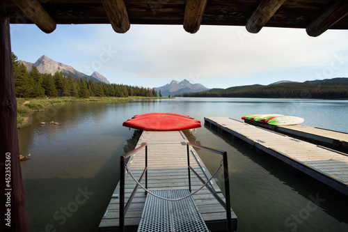 Red canoes on beautiful mountain lake