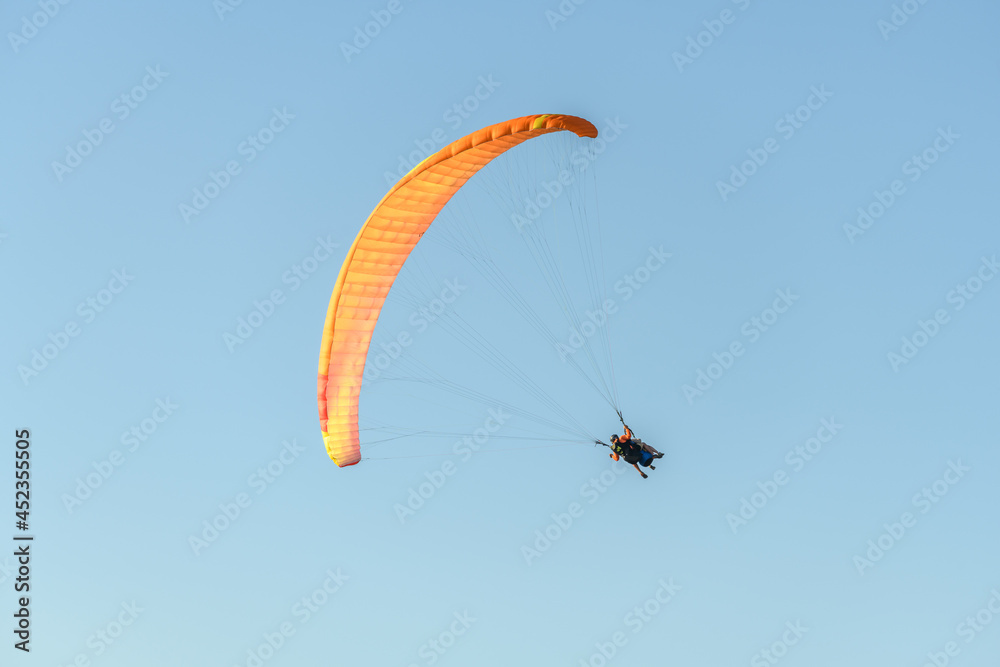 Paragliding flight in the air over the mountains. Paragliding flight in the air over the mountains.
