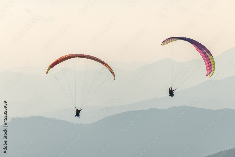 Paragliding flight in the air over the mountains. Paragliding flight in the air over the mountains.
