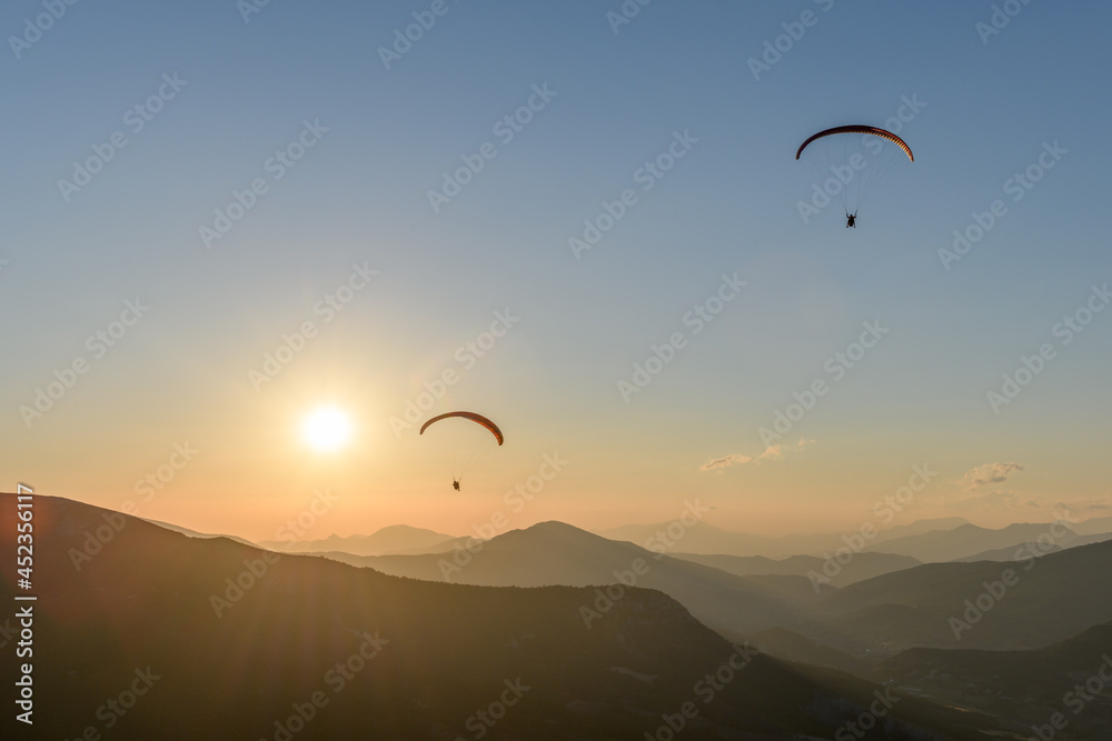 Paragliding flight in the air over the mountains. Paragliding flight in the air over the mountains.