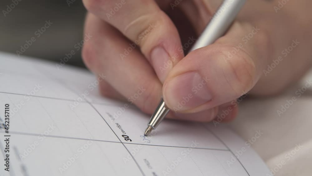 close up of hand writing on paper, notebook with dates, business meeting, businesswoman. bmpcc4k close up of hand writing on paper, notebook with dates, business meeting, businesswoman. bmpcc4k