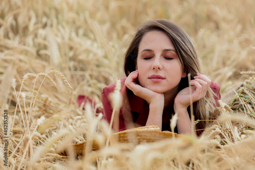 girl with straw hat on a yellow wheat field girl with straw hat on a yellow wheat field