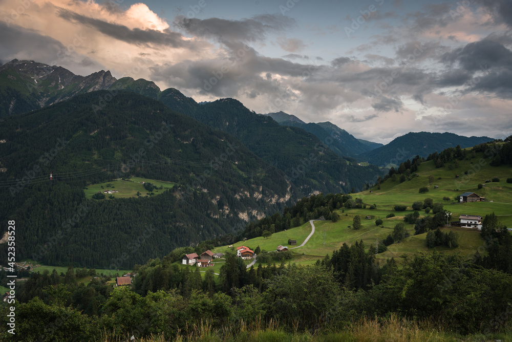 Alpine green landscape in summer on a cloudy day, ski resort, Vorarlberg, Austria