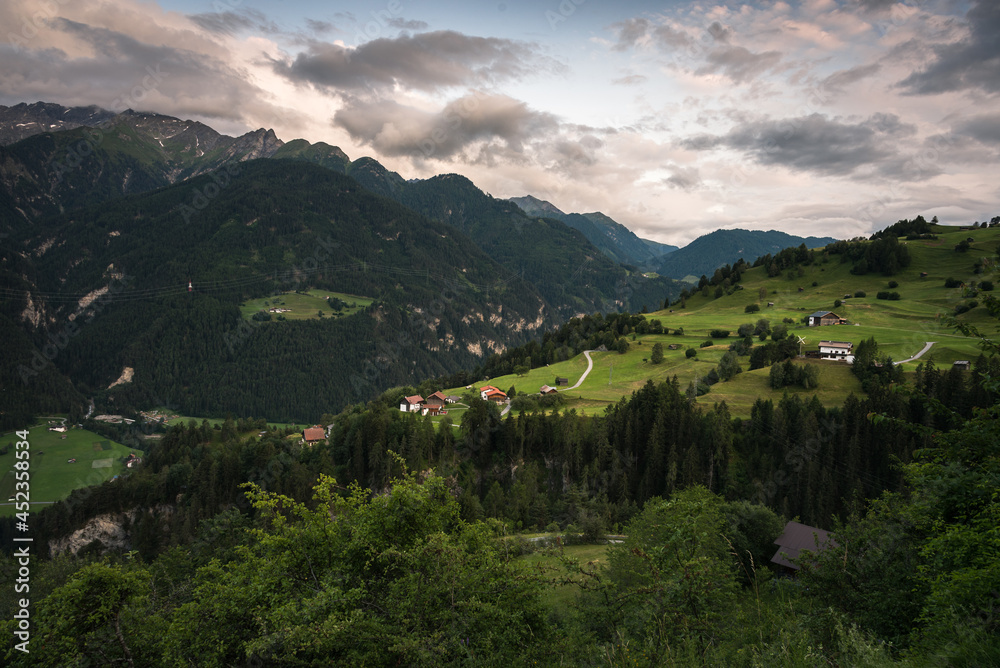 Alpine green landscape in summer on a cloudy day, ski resort, Vorarlberg, Austria