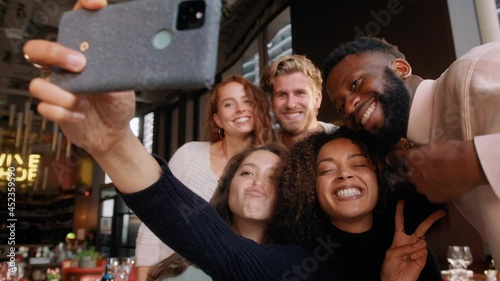 Slow motion of friends in wine bar taking selfie photo