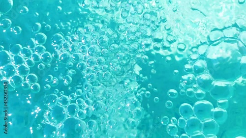 Bubbles in blue water. Purity and moisture concept. Beauty pattern. photo