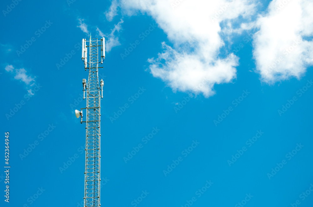 tower with antens for mobile communication and Internet transmission against the blue sky. High quality photo