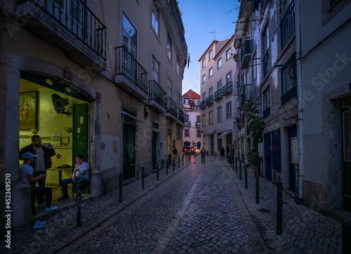 Life on the streets of the old city at sunset. Evening in the center of the old city of Lisbon. Alfama. Portugal. © Svetlana