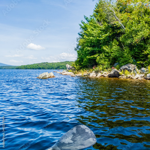 rocks on the edge of Somerset reservoir Vermont taken from the water in a canoe