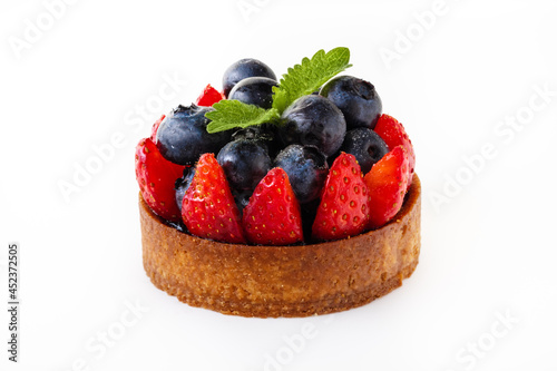 The cake with blueberries  strawberry and leaves of mint  isolated on white background. For desing.