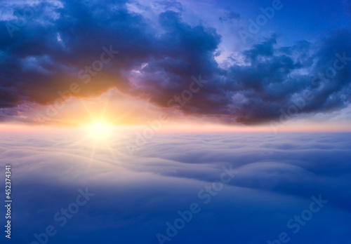 The sky above the clouds before dawn. Wonderful heavenly landscape.