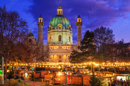 Festive cityscape - view of the Christmas Market on Karlsplatz (Charles' Square) and the Karlskirche (St. Charles Church) in the city of Vienna, Austria, 3 December, 2019 photo