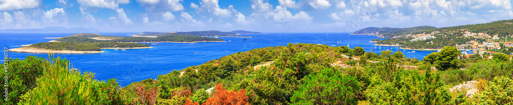Coastal summer landscape, panorama - view from the island of Hvar to the Paklinski Islands and the town of Hvar, the Adriatic coast of Croatia