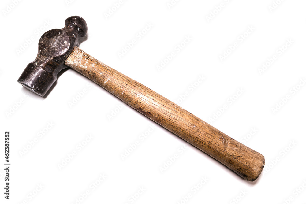 An old hammer with a wooden handle on a white background